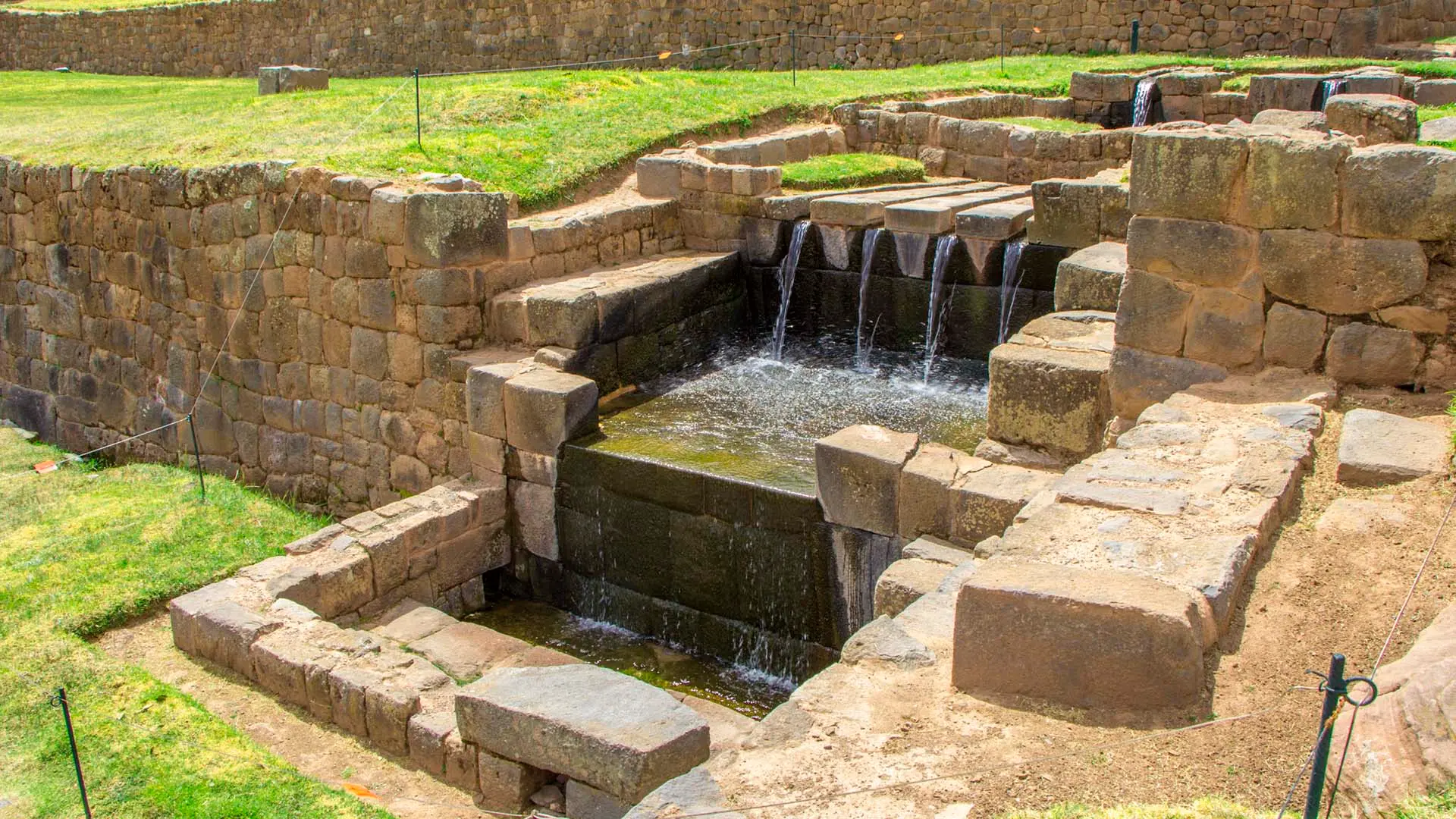 Ancient Inca water channels at Tipon archaeological site Cusco